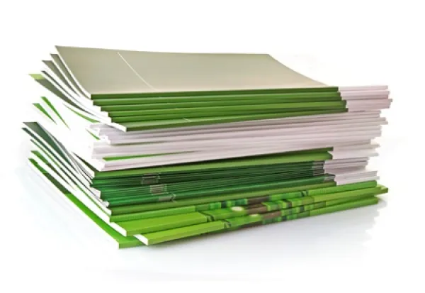 a stack of soft covered books