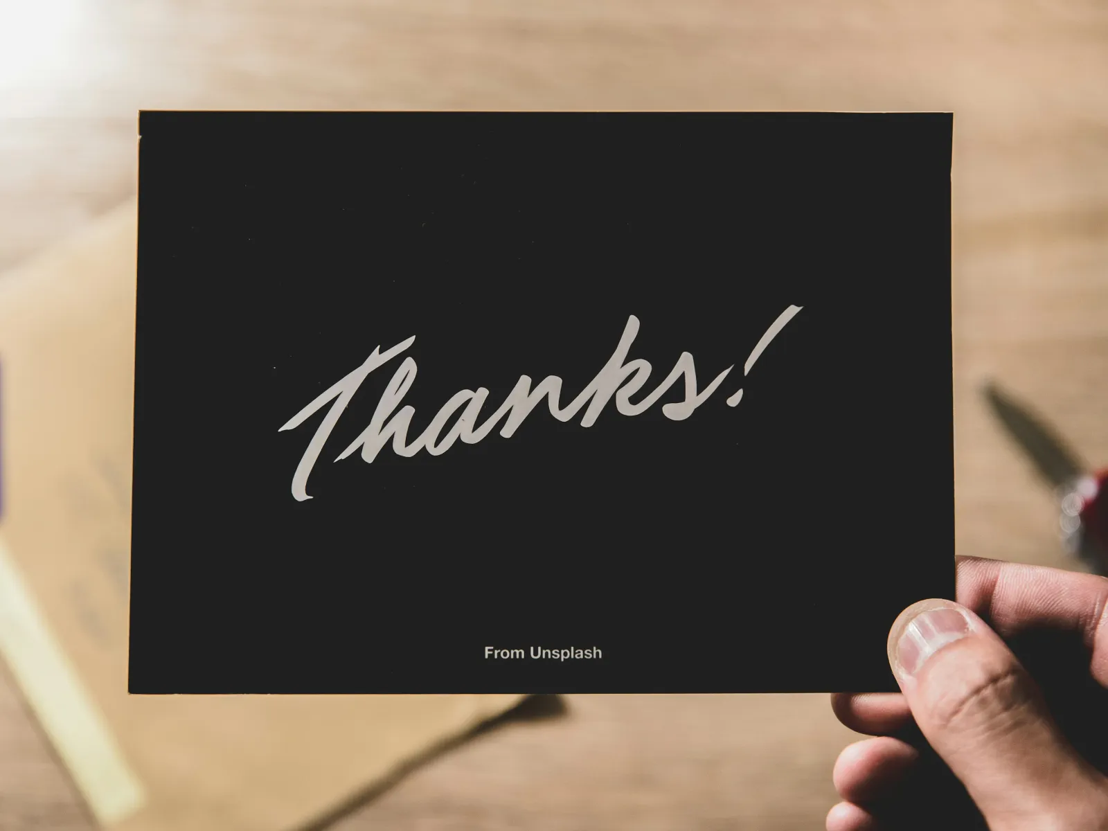 handwritten note on a postcard